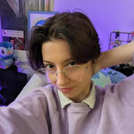 selfie of PokiPwet, a white person with short dark hair and big glasses